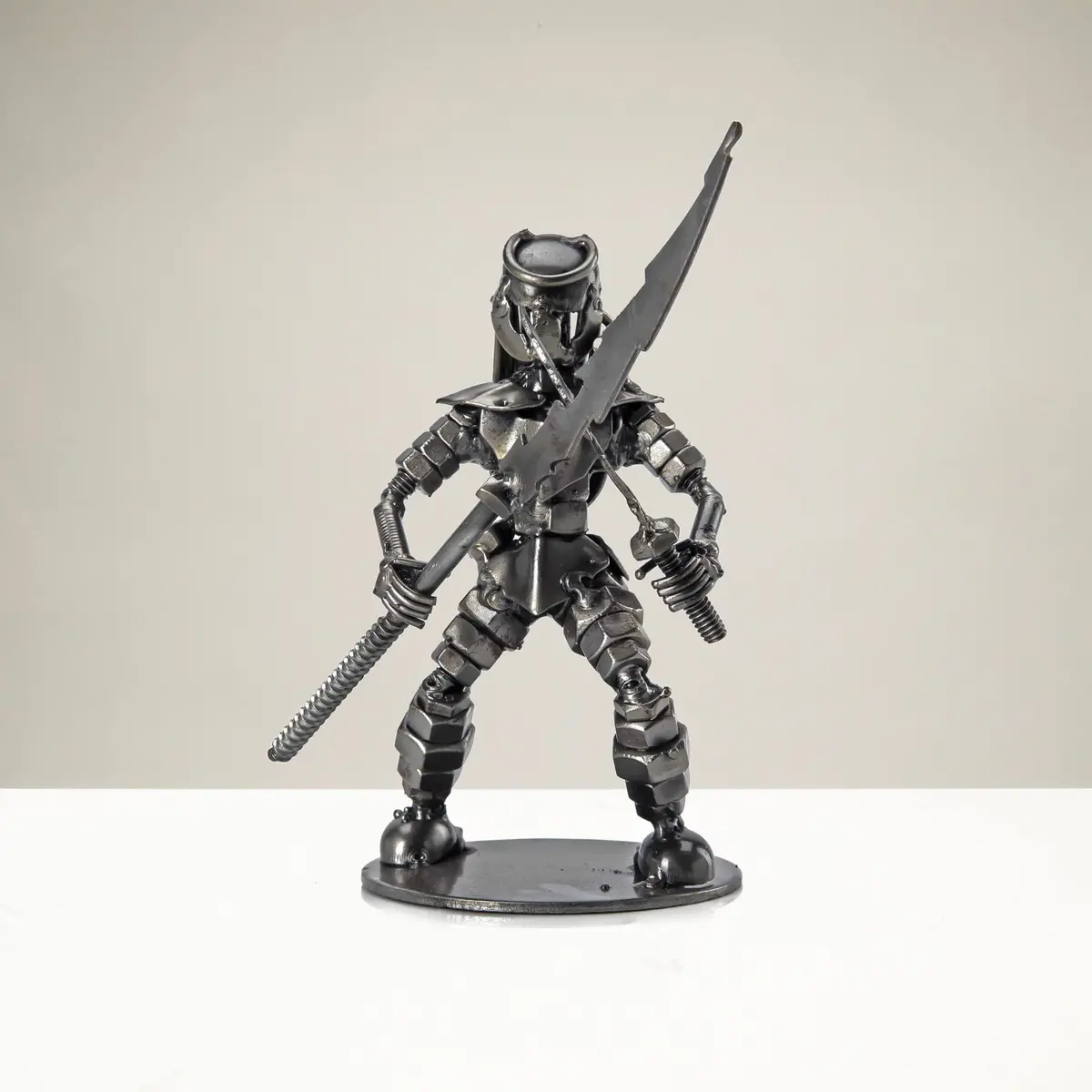 Dual Wielding Predator With Spear Inspired Recycled Metal Sculpture 1