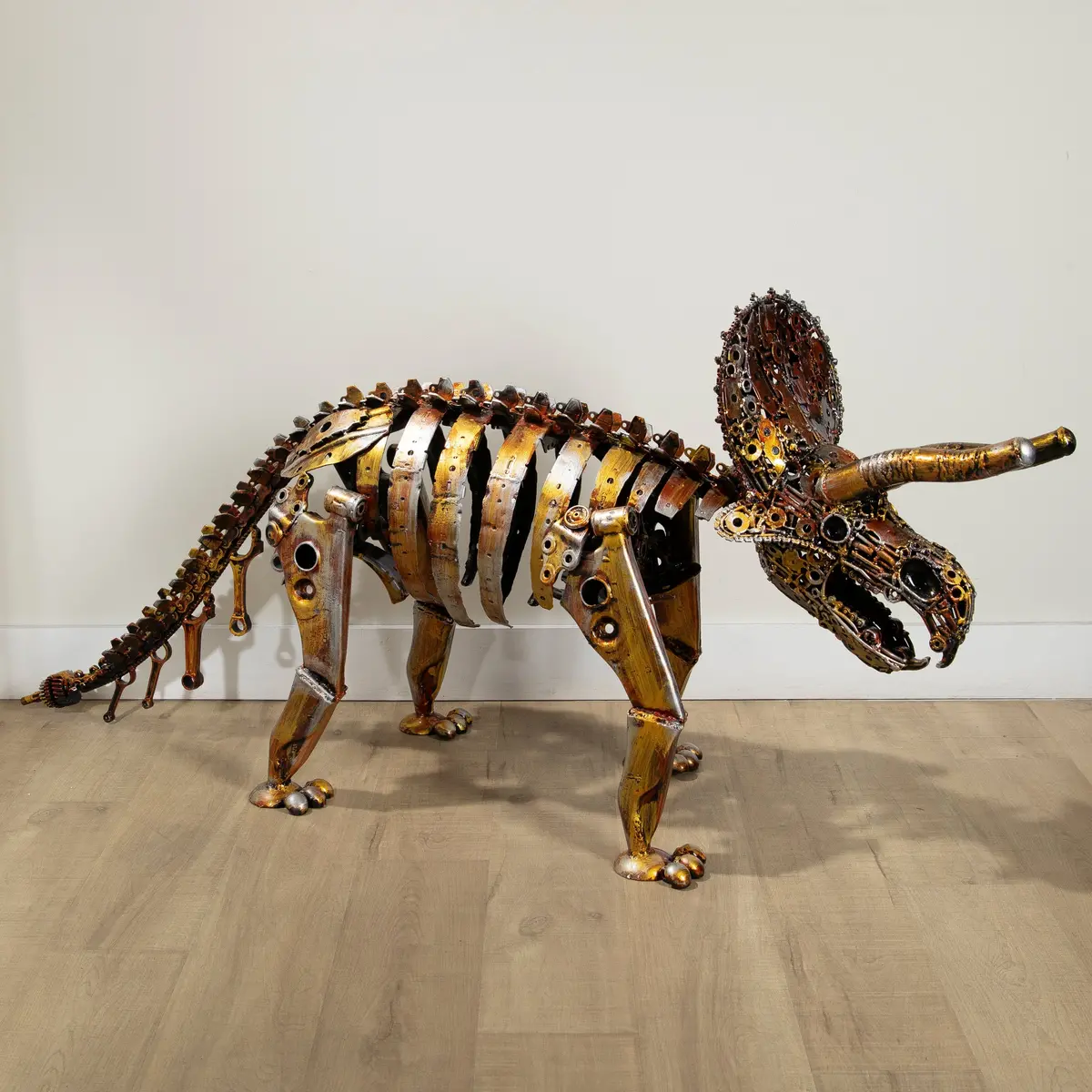 Gold Triceratops Skeleton Inspired Recycled Metal Sculpture 1